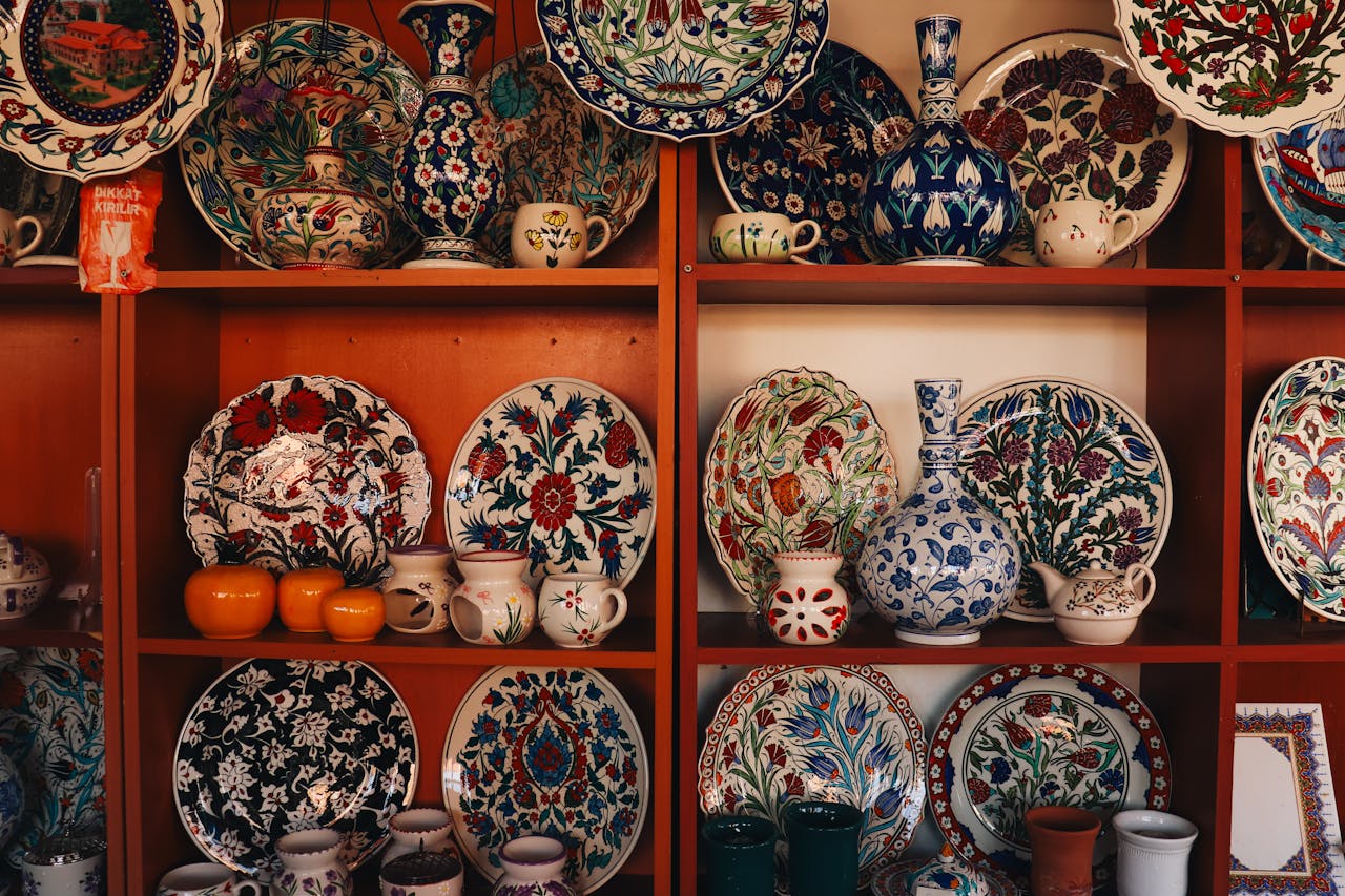 about-01 Collection of colorful İznik ceramics on display shelves in Bursa, showcasing traditional Turkish art.